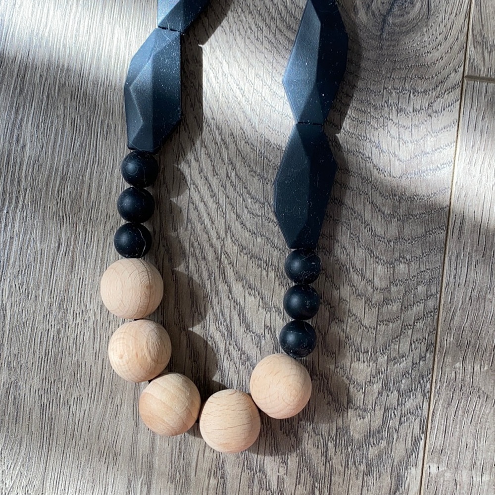 Teething necklace. Wood and silicon. Never used.
